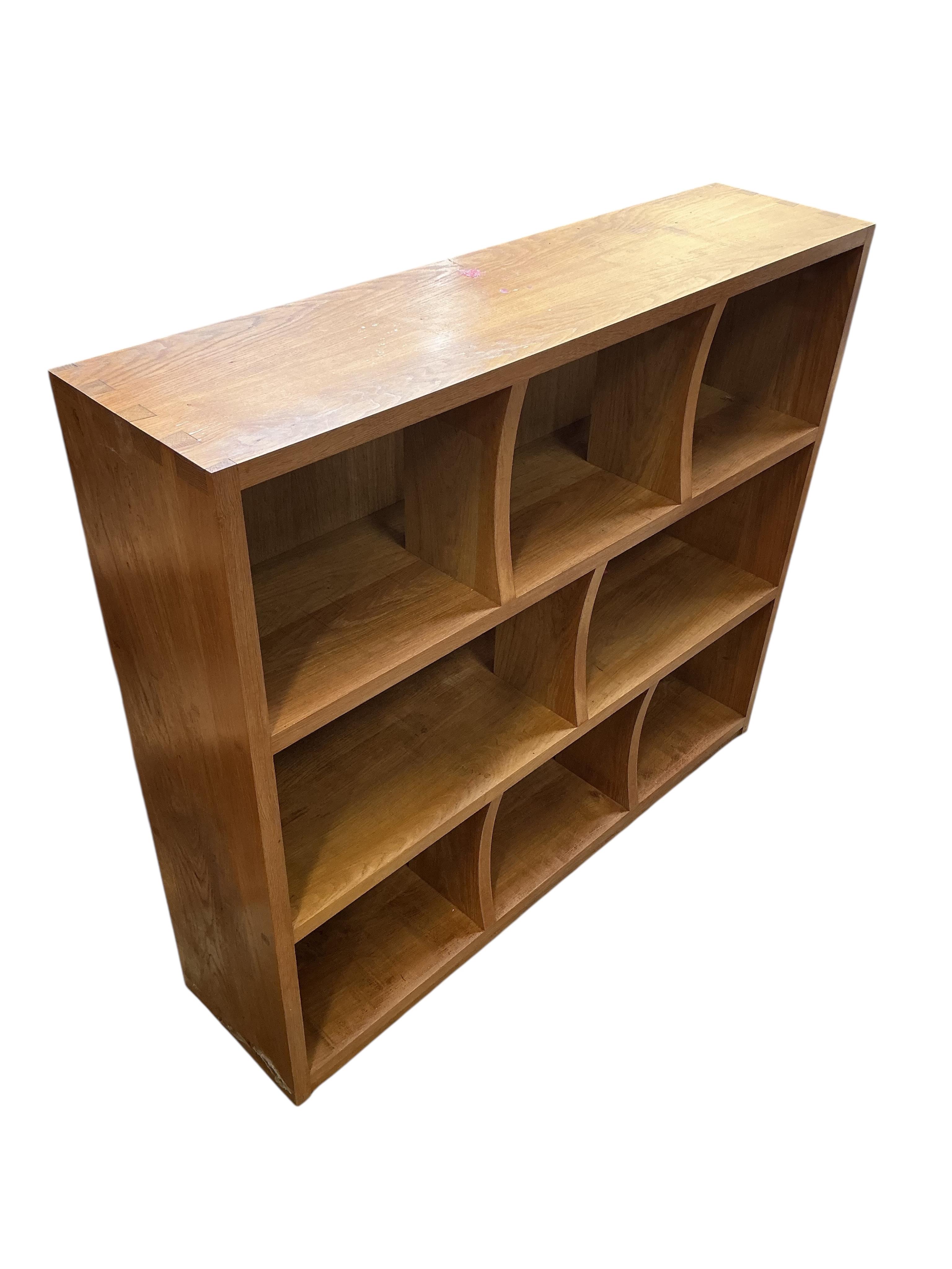 A pair of bespoke oak open bookcases, each width 132cm, depth 30cm, height 107cm